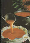 (Graphic Only) Ladle pouring soup into a bowl, pot of soup in background