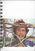 (Graphic Only) White Cover with an Image of a Person Behind Branches