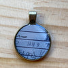 Book Lover Necklace -- January 9 (various marks in pencil around the date)